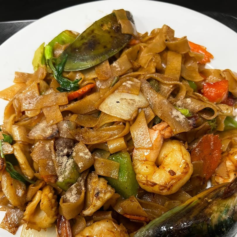 U-D Thai Restaurant's Pad See Ew with flat noodles, shrimp, mussels, and vegetables.